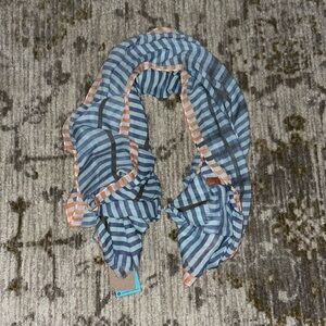 Prana Lucinda Scar in a blue and orange stripped pattern. Square style